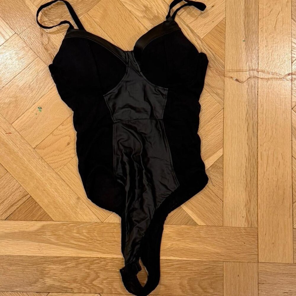 Black leather and sheer bodysuit